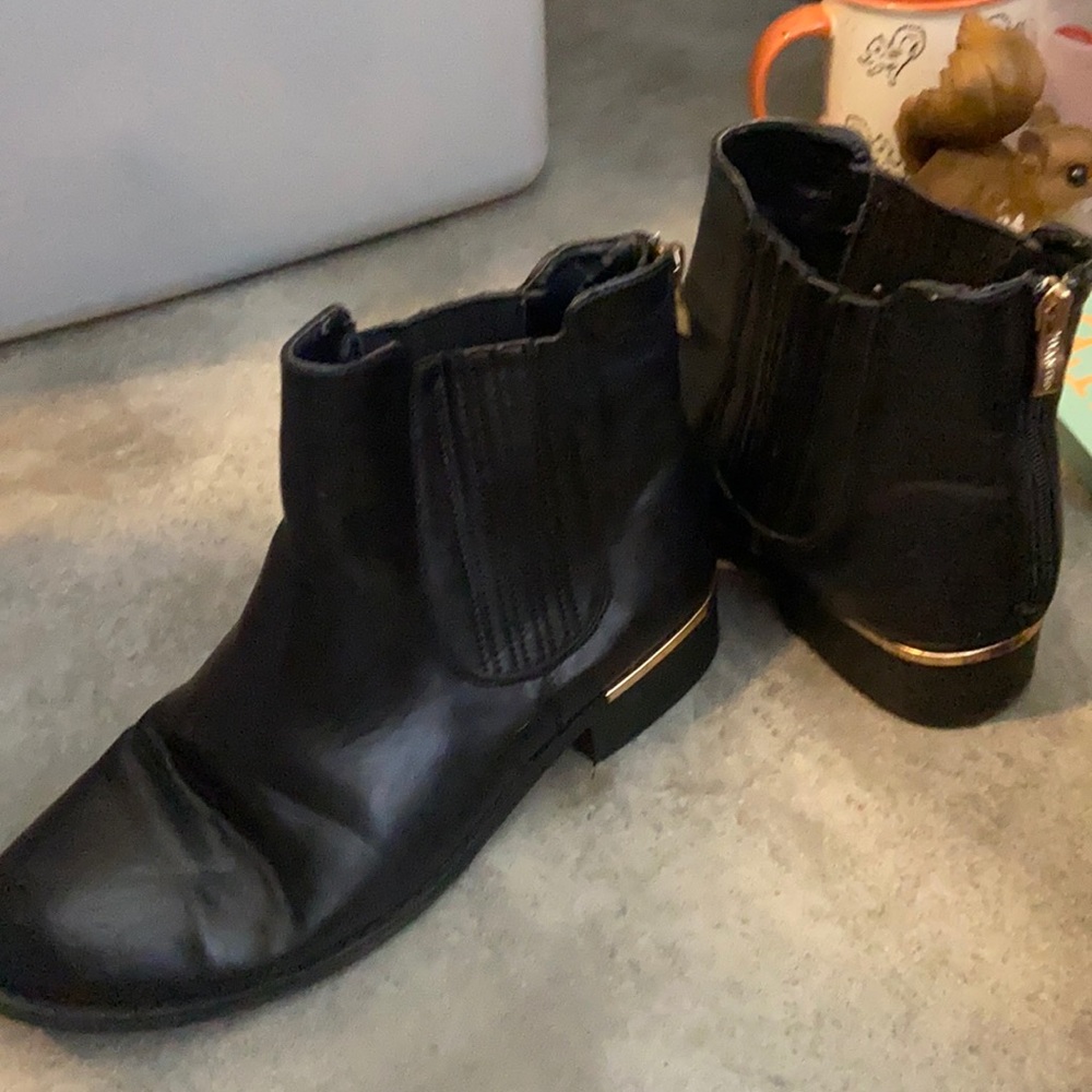Black booties with gold accent